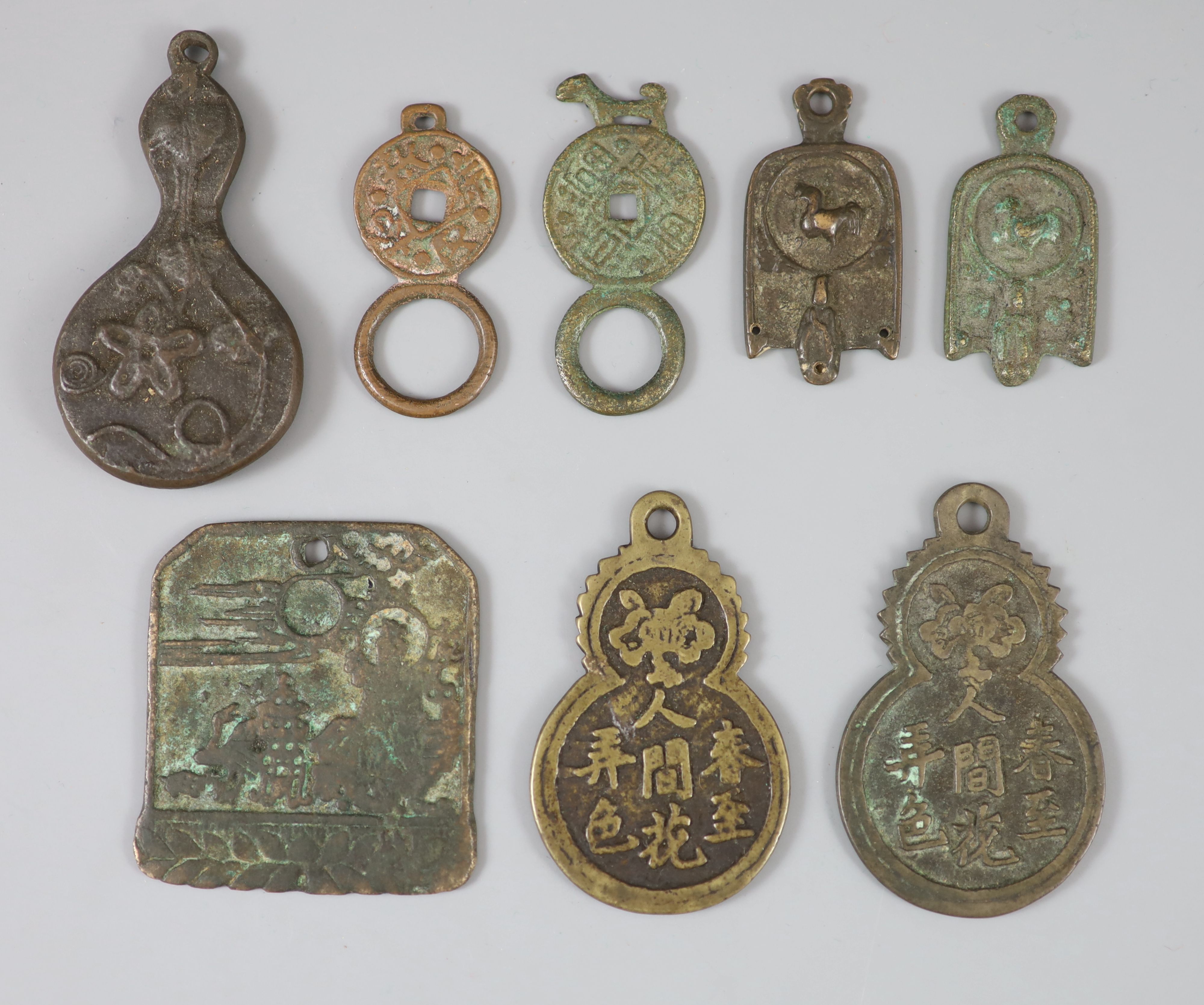 China, 8 bronze charms or amulets, Qing dynasty or earlier,